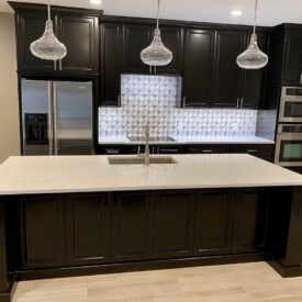 Open concept kitchen by removing interior wall and installing steel beam to support weight of second story